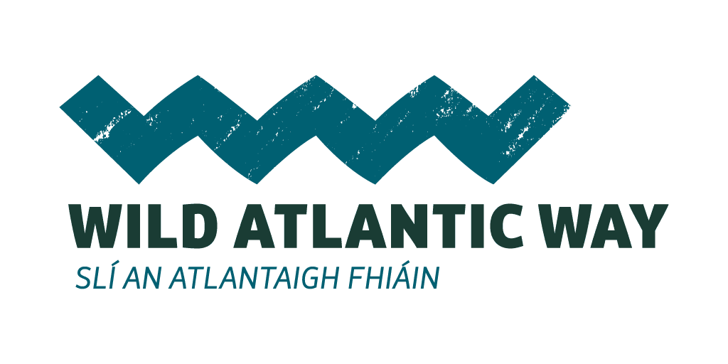 Wild Atlantic Way logo with a blue zigzag wave above bold text reading WILD ATLANTIC WAY and smaller Irish text SLÍ AN ATLANTAIGH FHIÁIN underneath, inviting you to Explore Galway, all set on a light background.