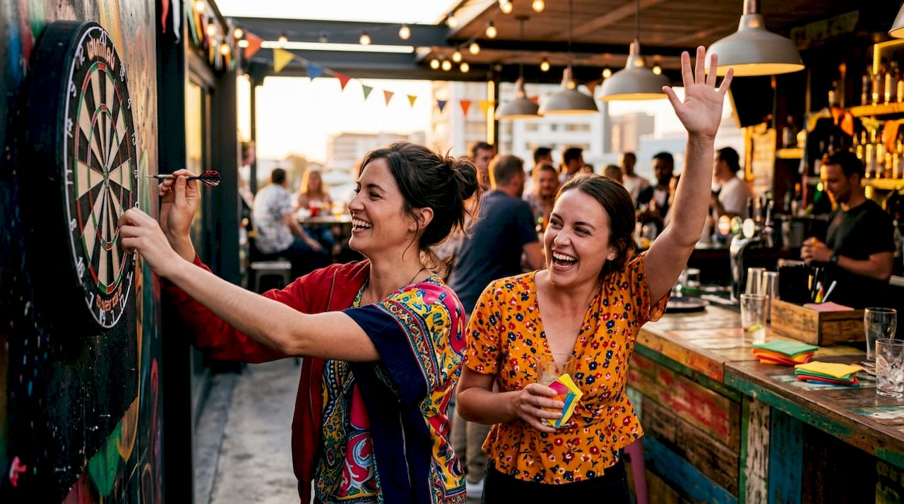 Hen party group playing lively drinking game at pub