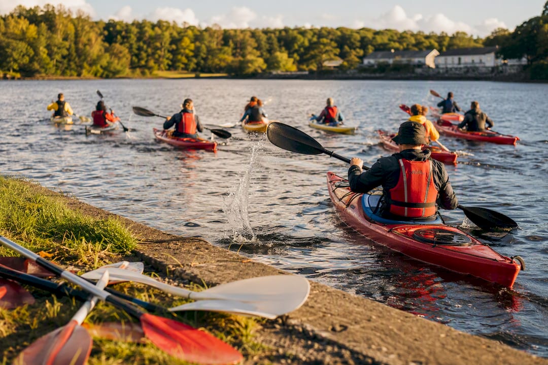 Hands paddling kayaks on Rusheen Bay