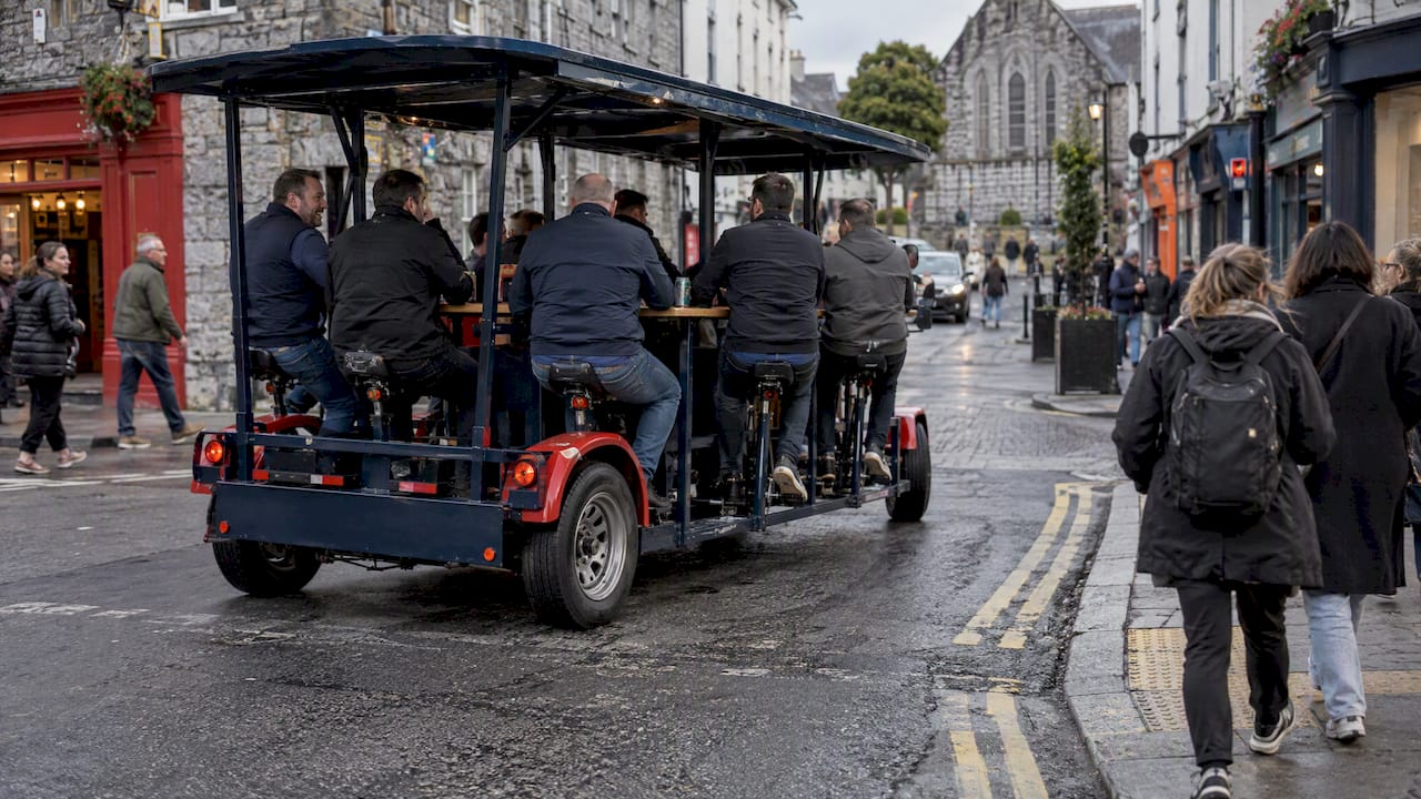 Party bike riders sharing a Galway street